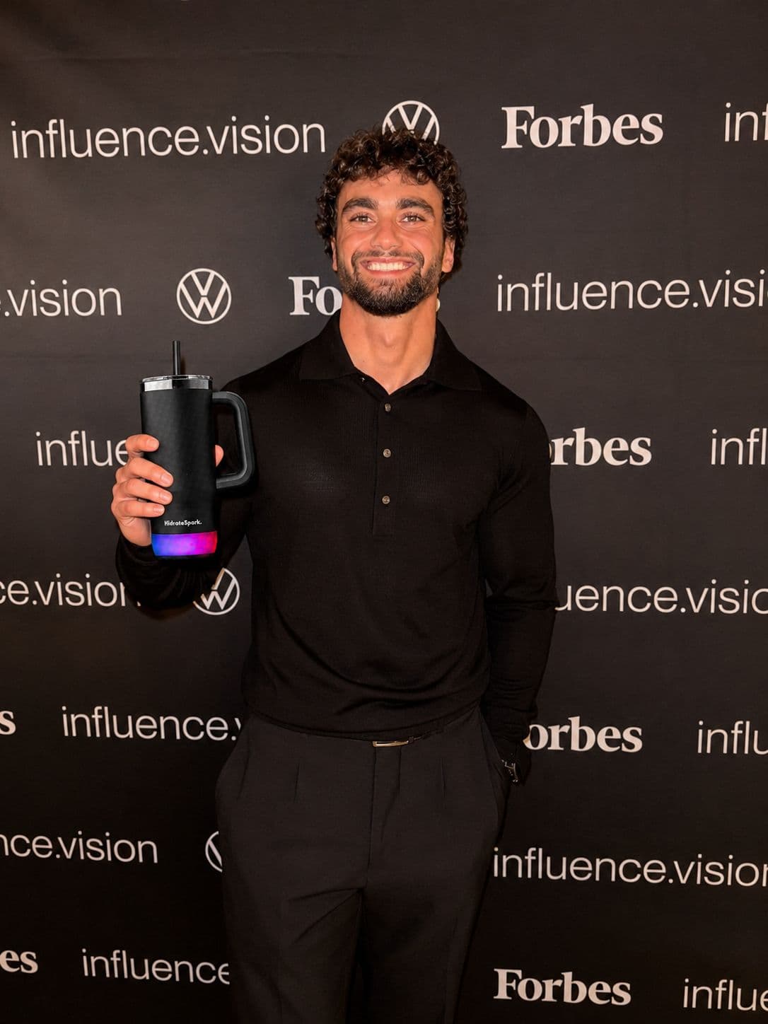 Arda Saatci holding the smart tumbler